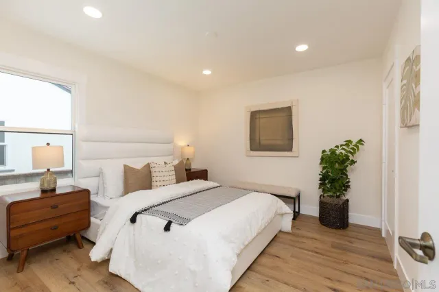 a bathroom with a bathtub sink and mirror