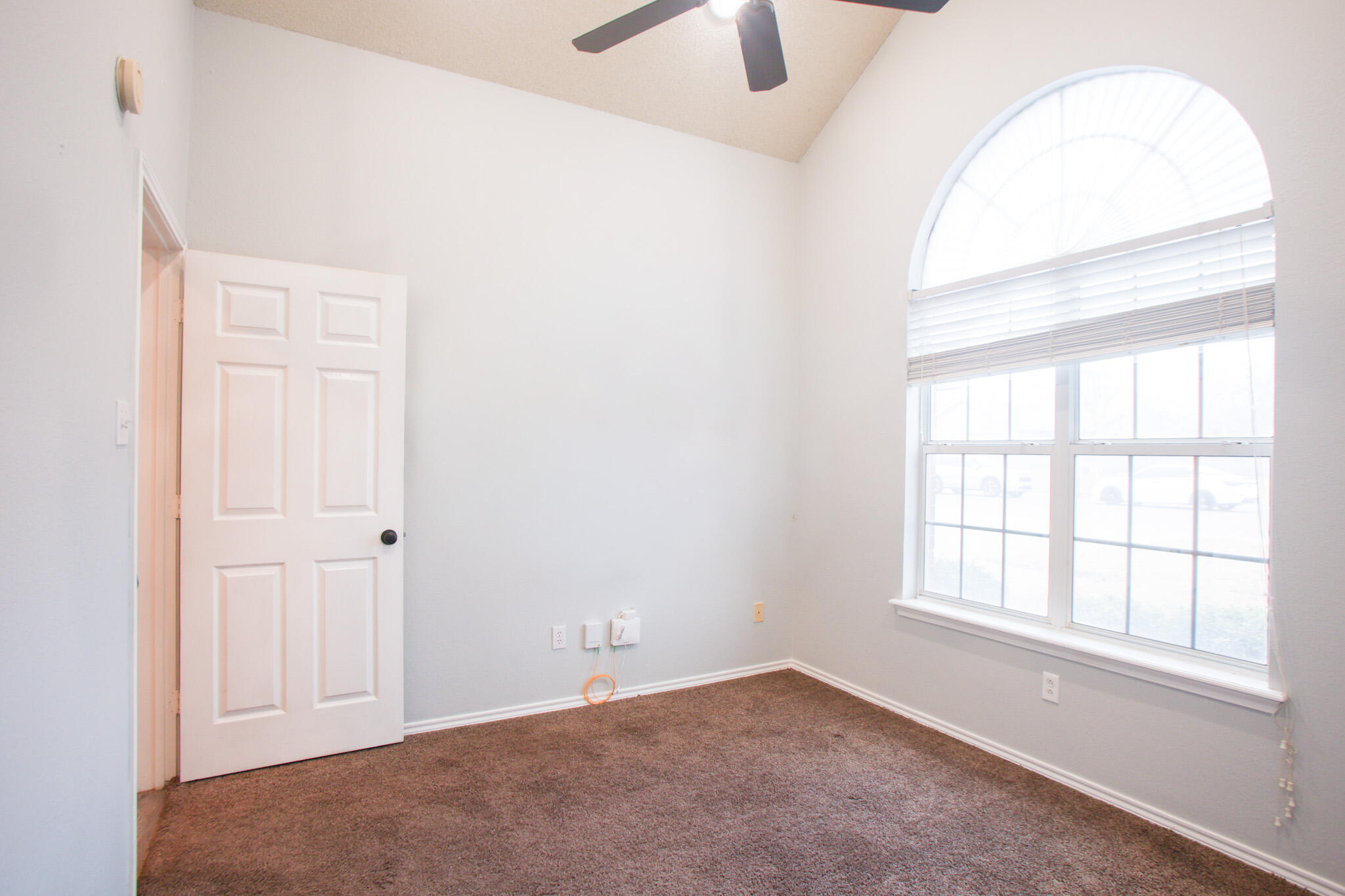 6916 Fulton Avenue Lubbock, TX 79424 - Photo 14 of 24 an empty room with windows and closet