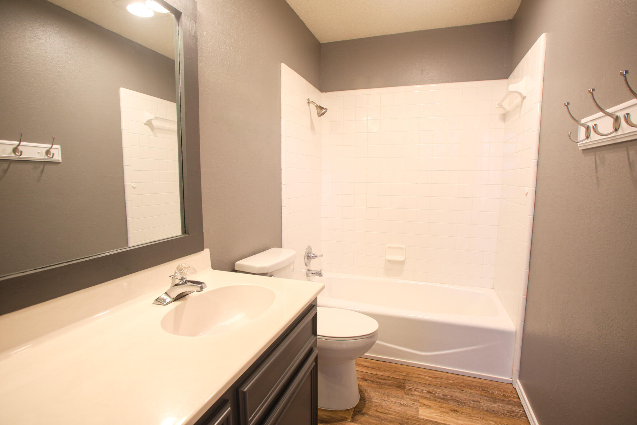 6916 Fulton Avenue Lubbock, TX 79424 - Photo 15 of 24 a bathroom with a sink and a mirror