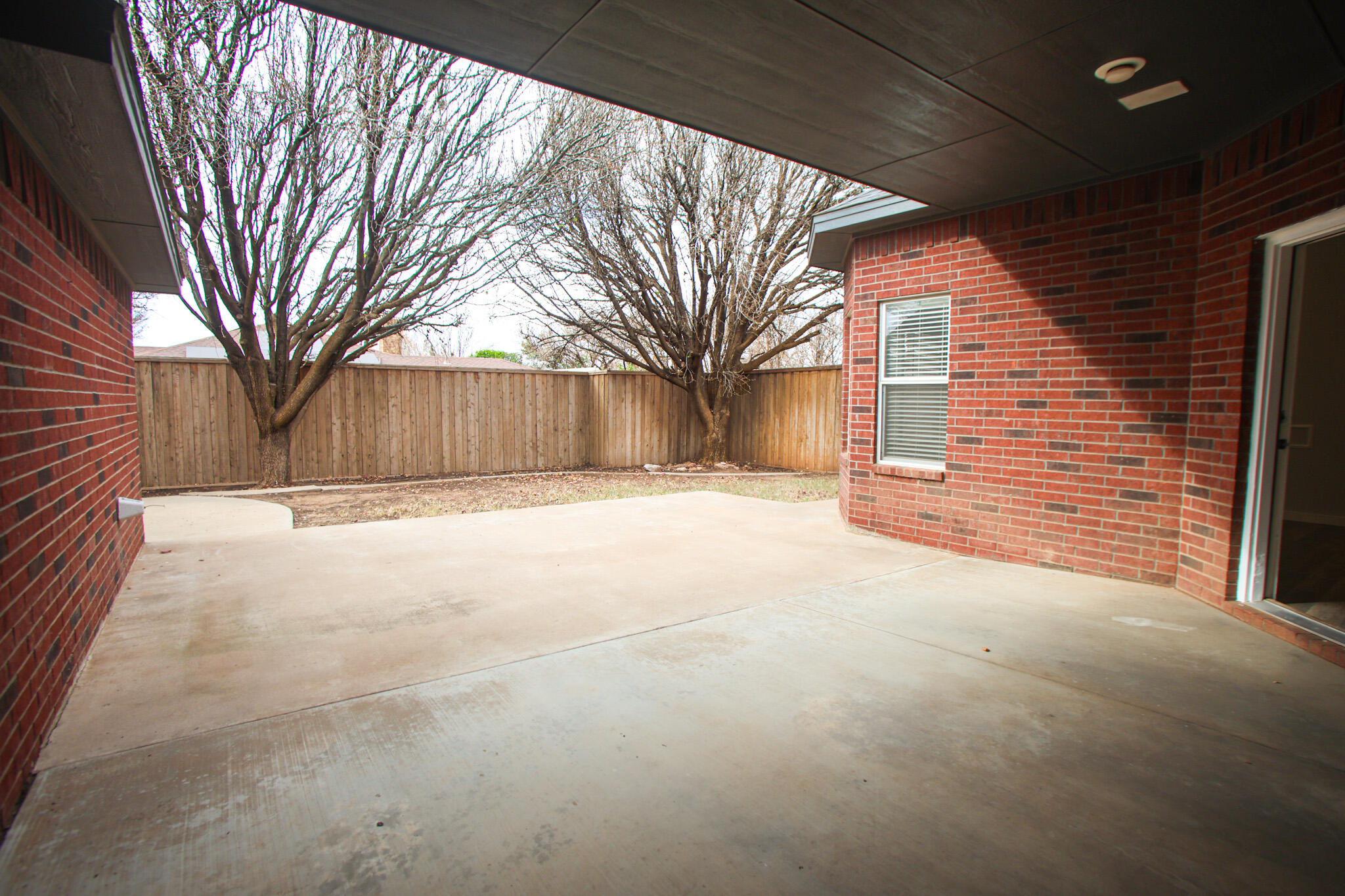 6916 Fulton Avenue Lubbock, TX 79424 - Photo 24 of 24 a view of a house with a yard covered in snow