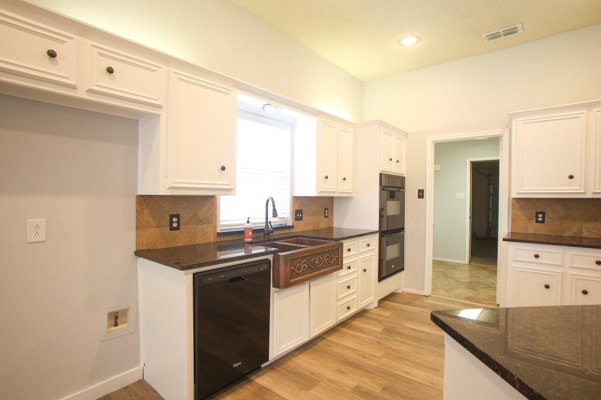 6916 Fulton Avenue Lubbock, TX 79424 - Photo 4 of 24 a kitchen with stainless steel appliances a sink stove and refrigerator