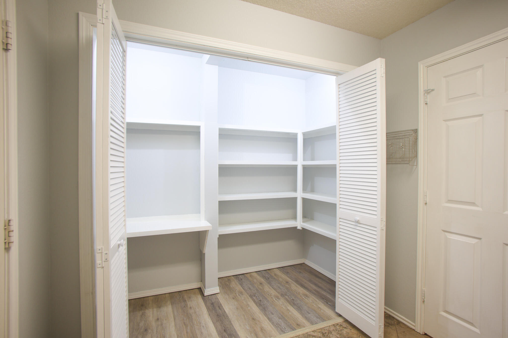 6916 Fulton Avenue Lubbock, TX 79424 - Photo 9 of 24 a room with walk in closet and empty racks