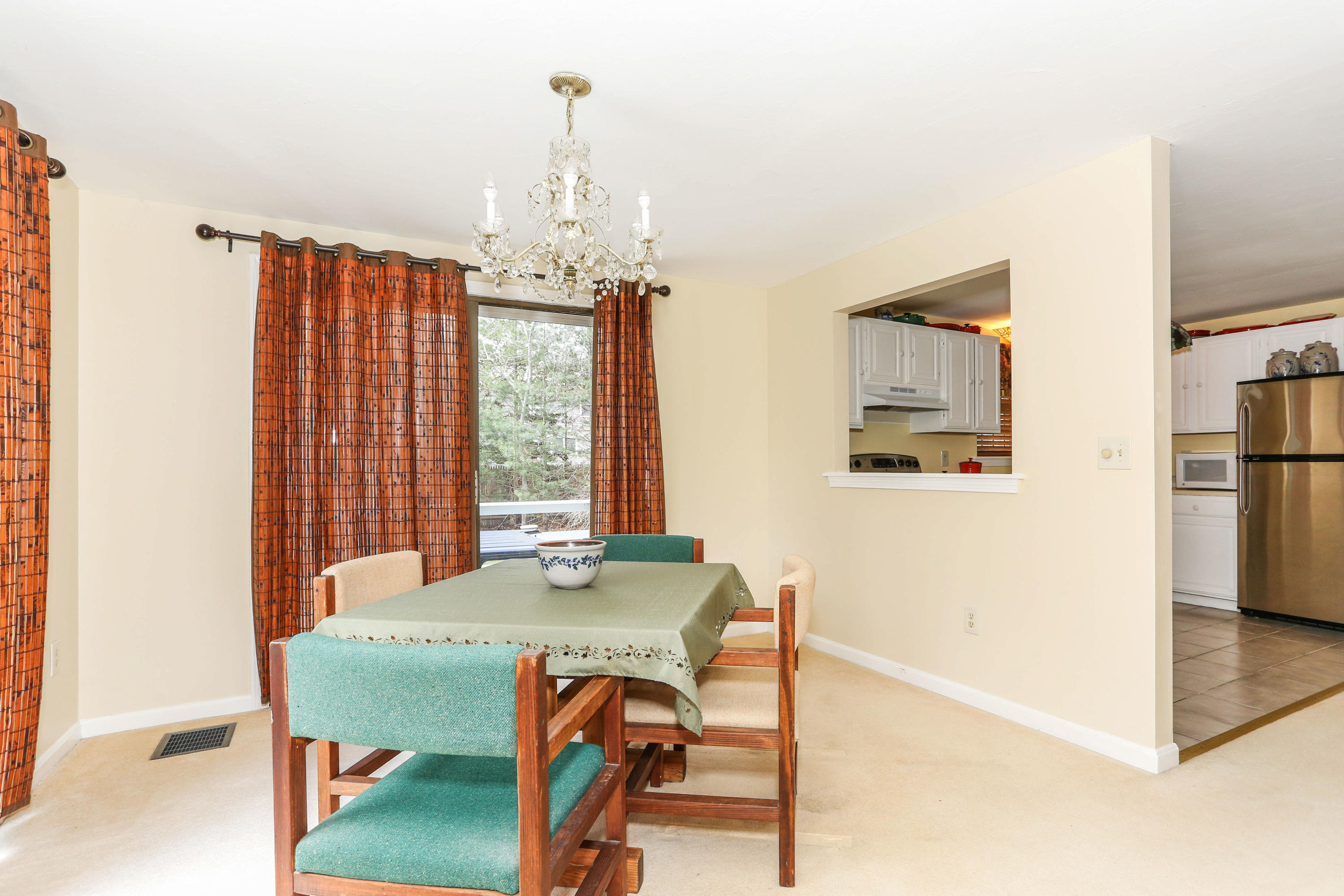 385 Skunknet Road Centerville, MA 02632 - Photo 14 of 32 a view of a dining room with furniture window and outside view