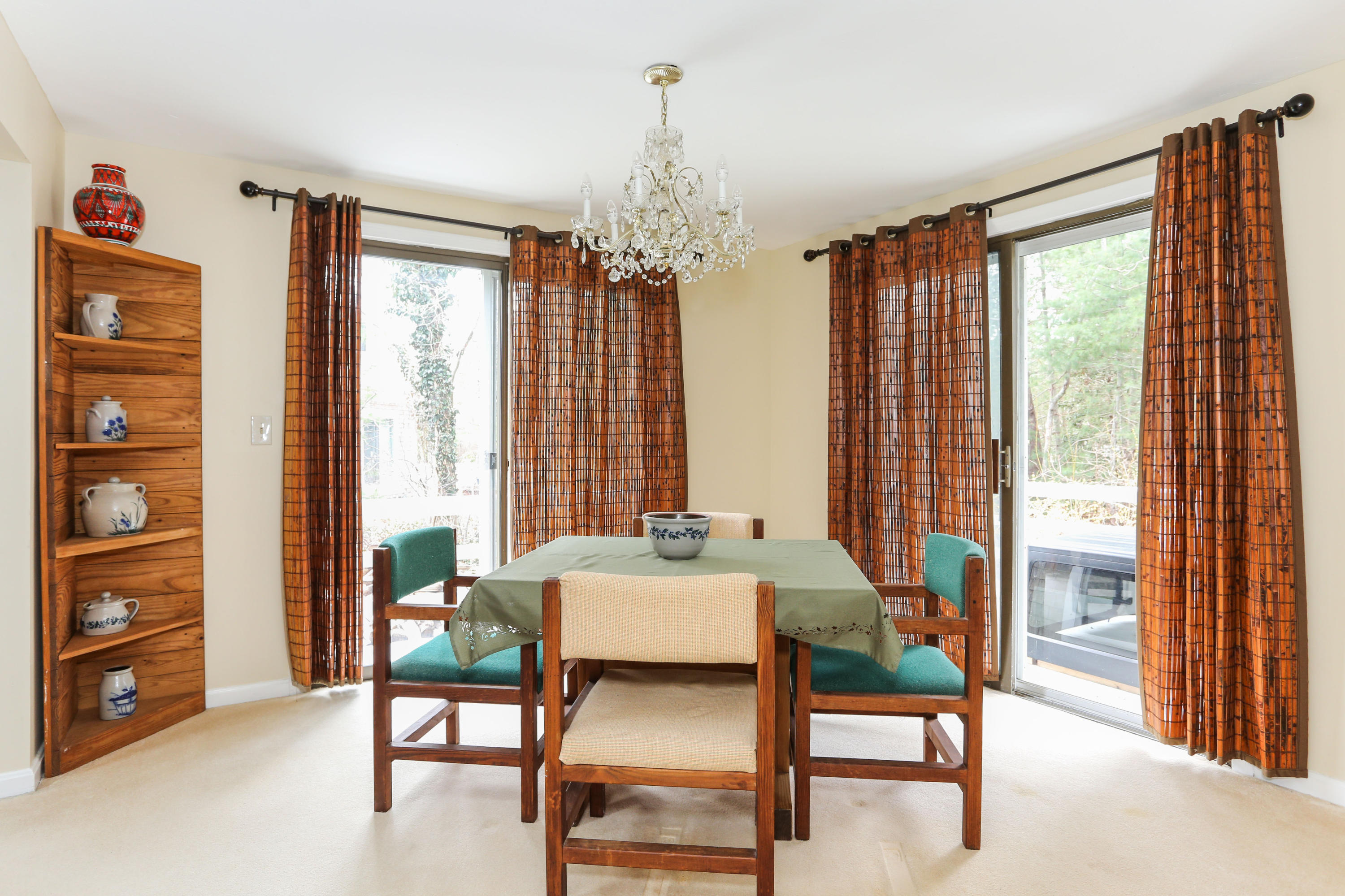 385 Skunknet Road Centerville, MA 02632 - Photo 15 of 32 a dining room with furniture and window
