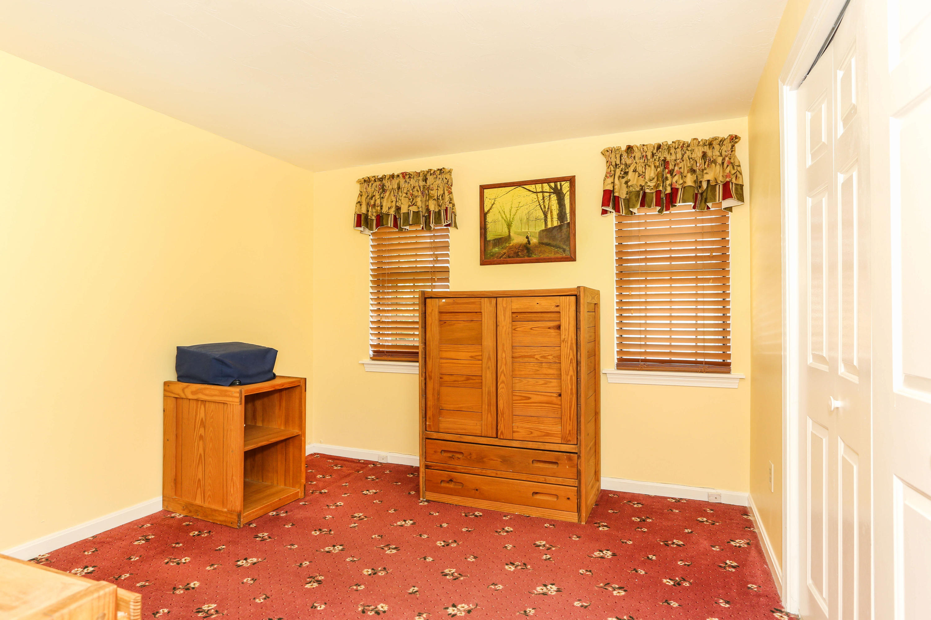 385 Skunknet Road Centerville, MA 02632 - Photo 18 of 32 a view of a livingroom with furniture and an empty room