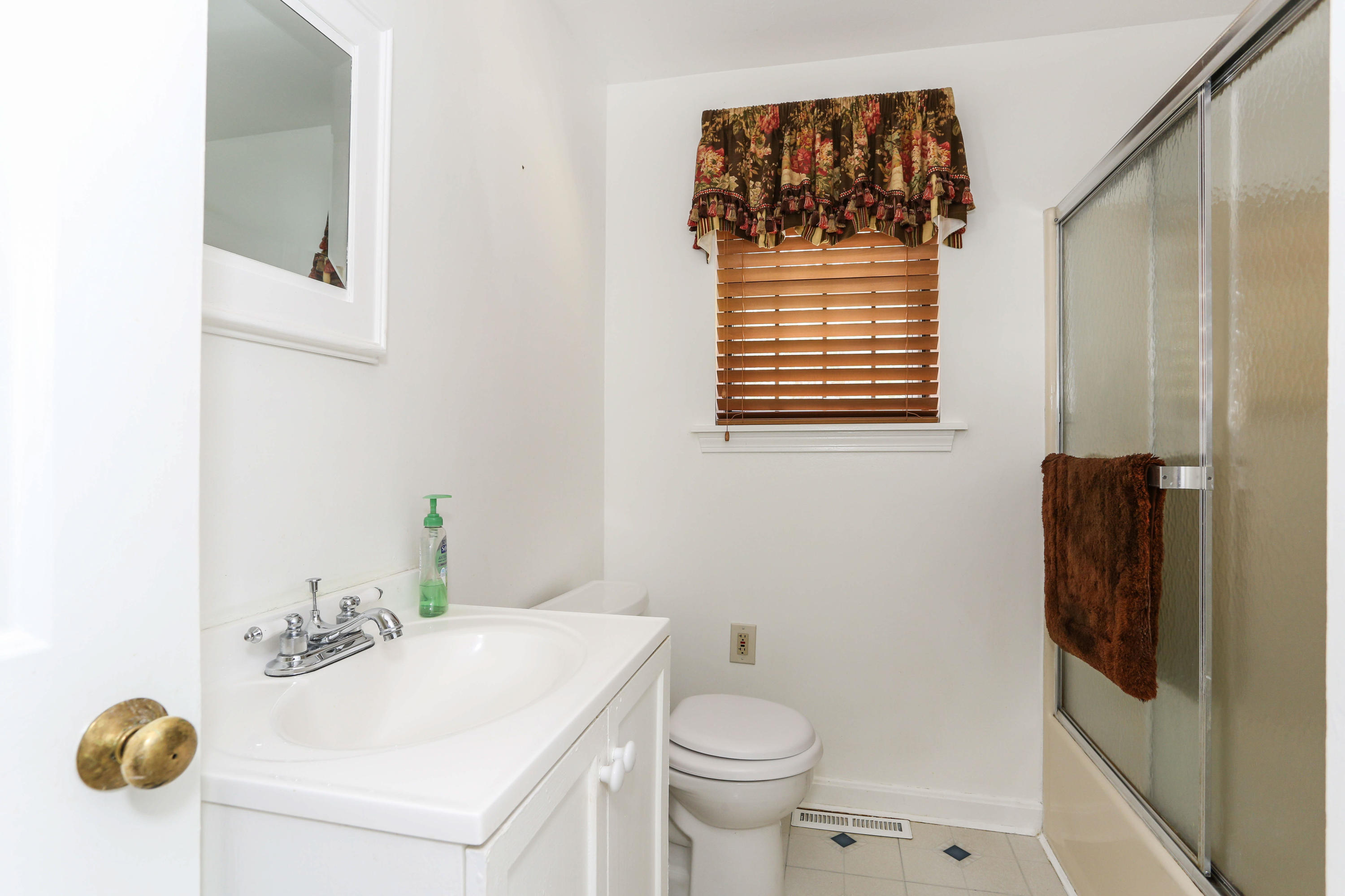 385 Skunknet Road Centerville, MA 02632 - Photo 20 of 32 a bathroom with a sink and a mirror
