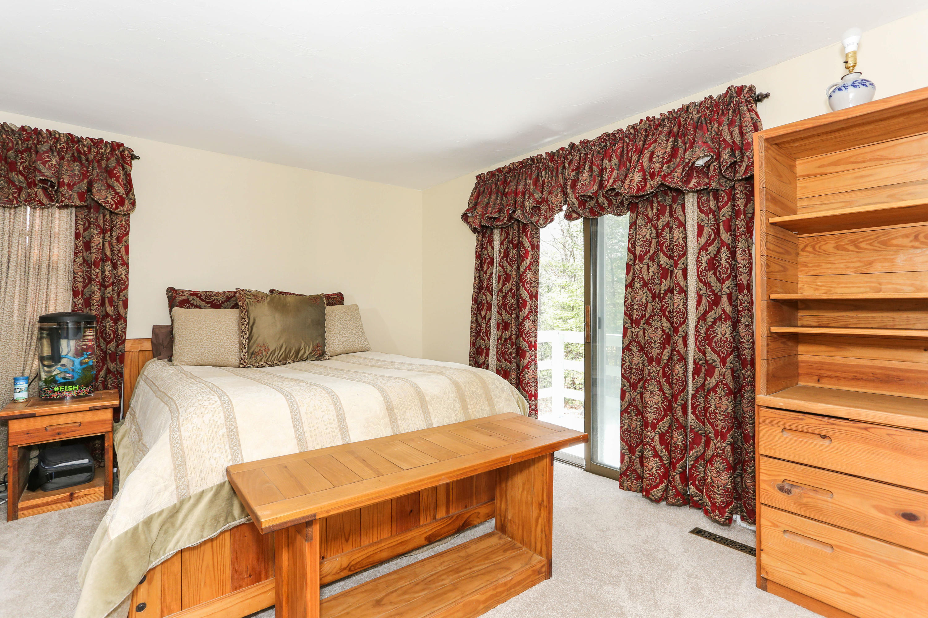 385 Skunknet Road Centerville, MA 02632 - Photo 21 of 32 a bedroom with a bed and a window