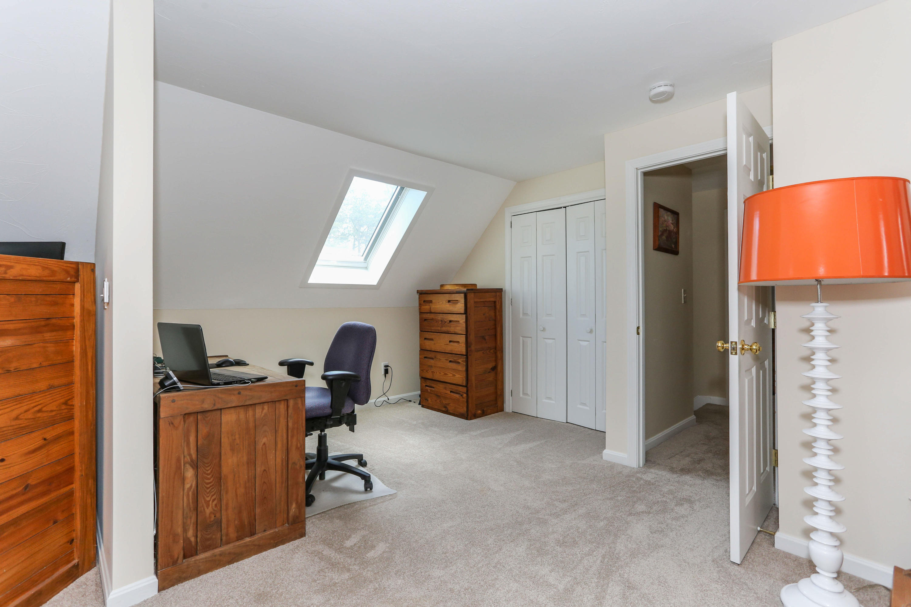 385 Skunknet Road Centerville, MA 02632 - Photo 29 of 32 a view of a workspace with furniture and a window
