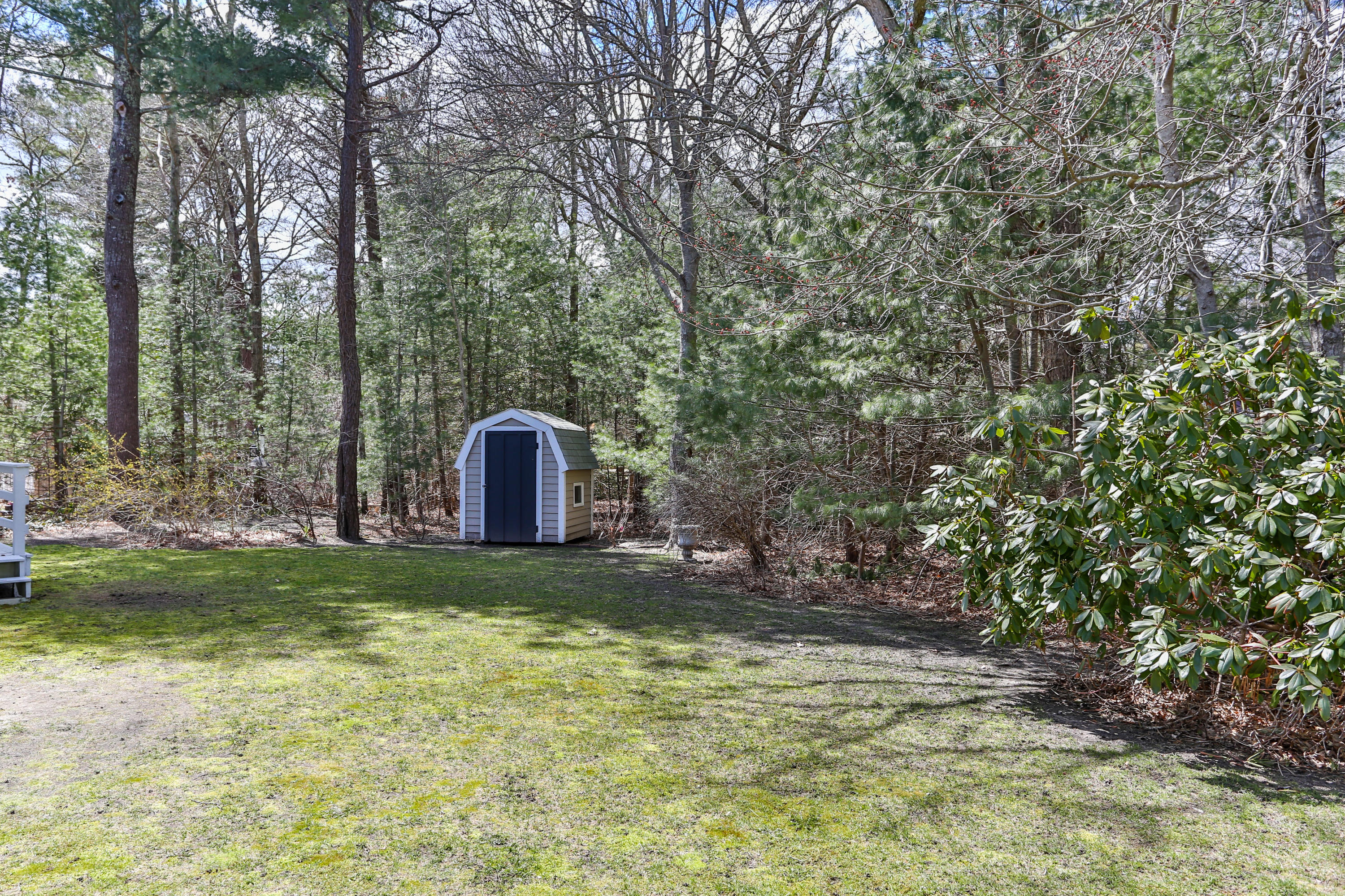 385 Skunknet Road Centerville, MA 02632 - Photo 6 of 32 a view of a back yard