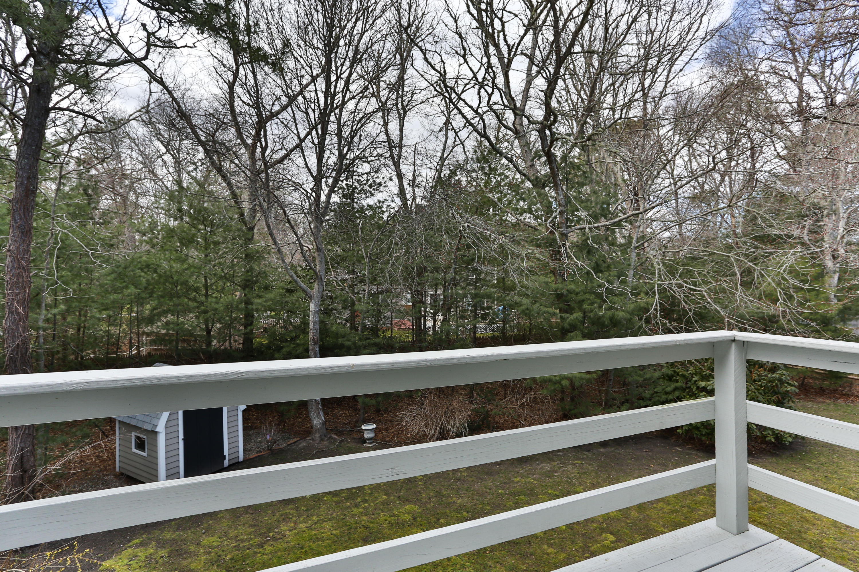 385 Skunknet Road Centerville, MA 02632 - Photo 7 of 32 a view of balcony with small trees
