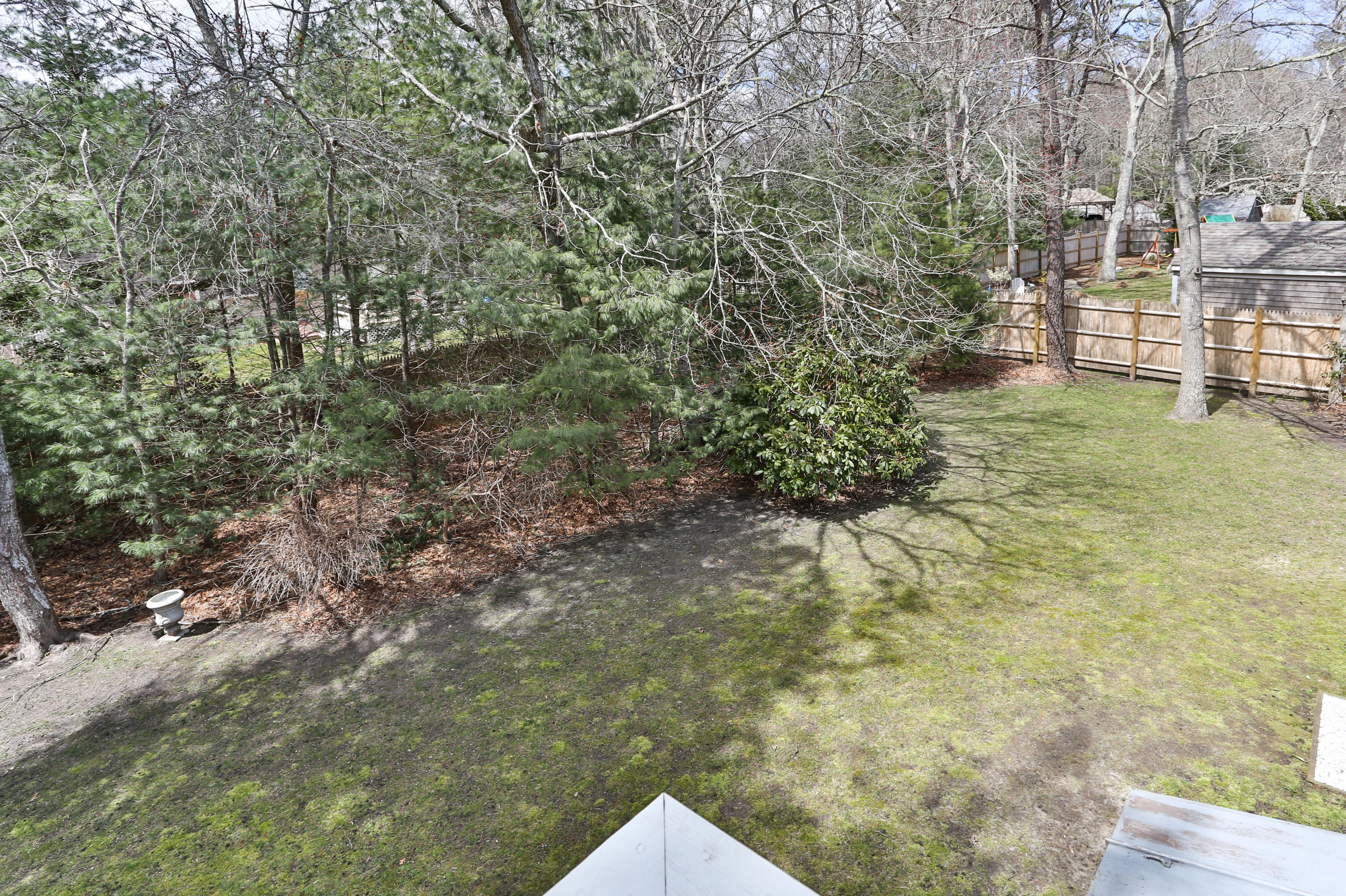 385 Skunknet Road Centerville, MA 02632 - Photo 8 of 32 a view of outdoor space and trees