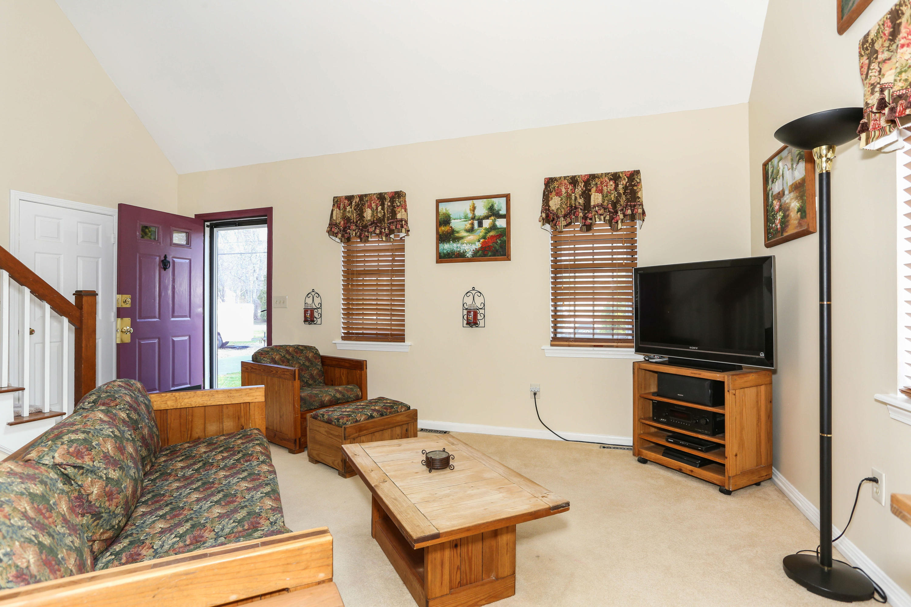 385 Skunknet Road Centerville, MA 02632 - Photo 10 of 32 a living room with furniture and a flat screen tv