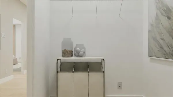 a bedroom with a bed and a night stand