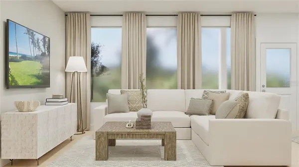 a living room with furniture and a large window