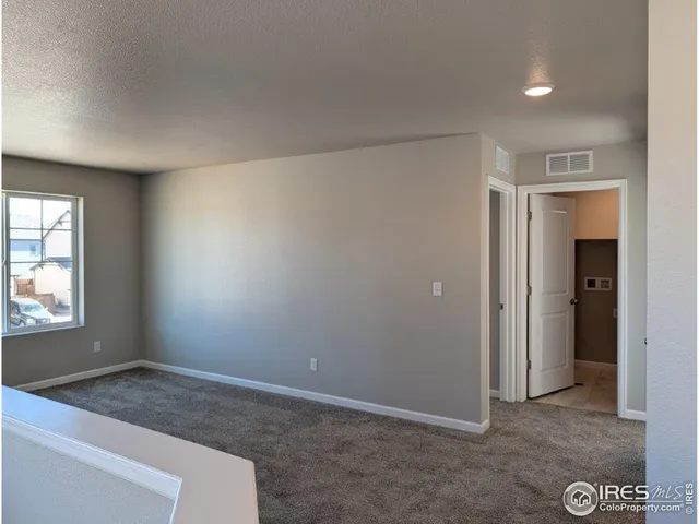 a view of an empty room and window