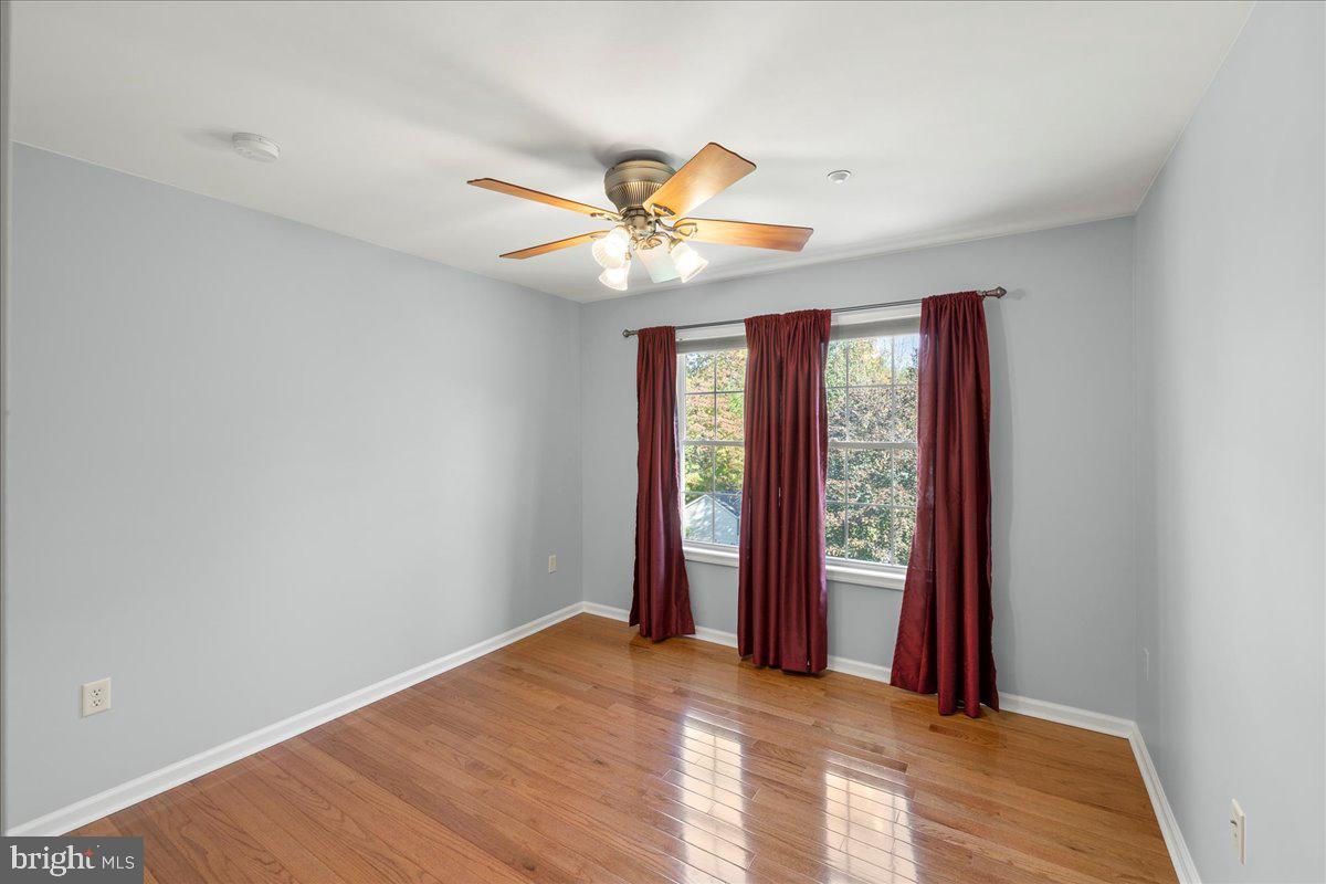 8 Pheasant Trail Fairfield, PA 17320 - Photo 47 of 69 a view of an empty room with window and chandelier fan