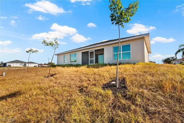 a house view with a backyard space
