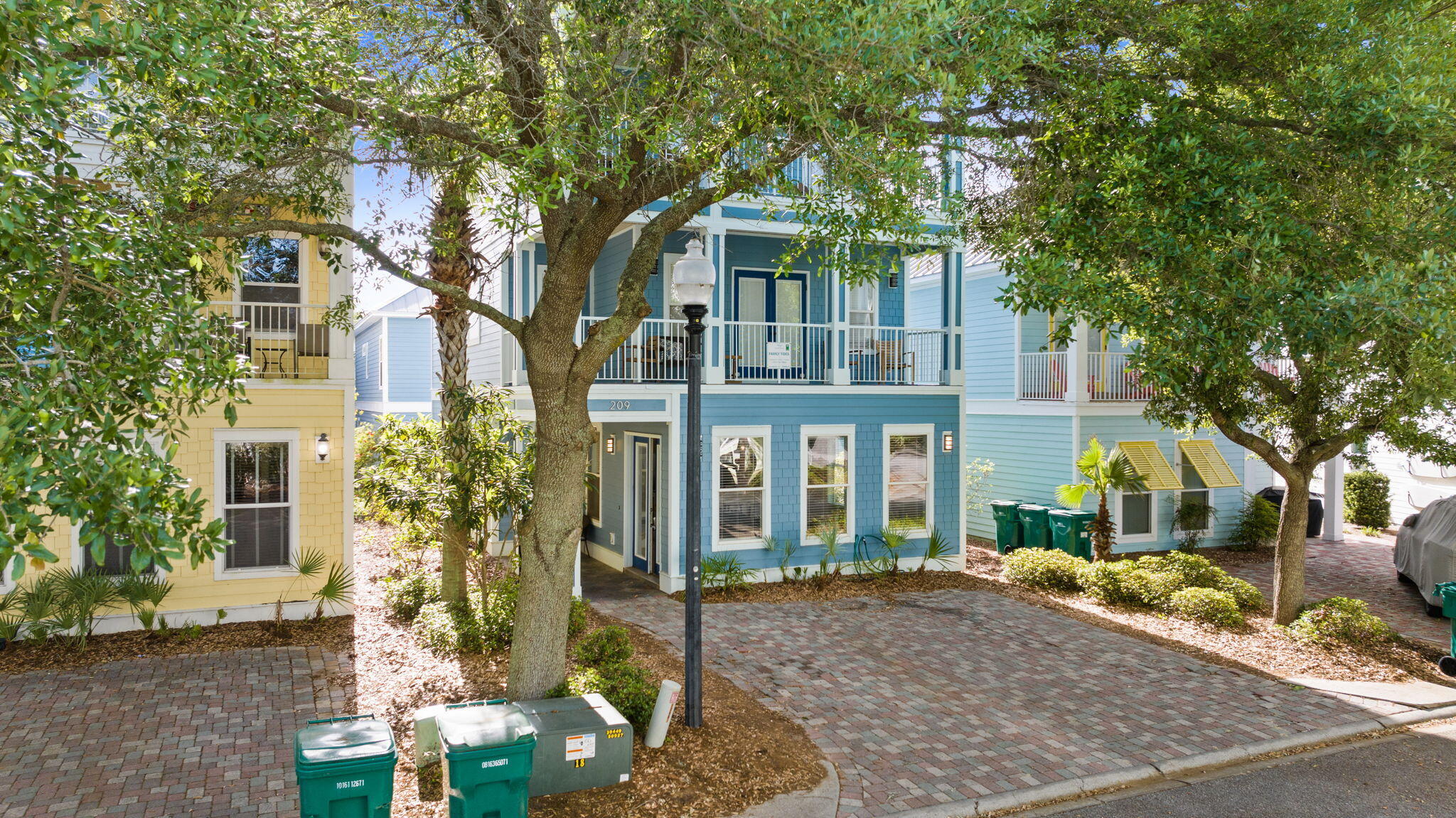 209 Grand Key Loop East Destin, FL 32541 - Photo 50 of 59 a front view of a house with garden