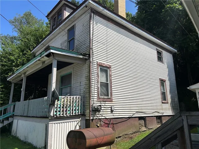 a view of a house with a roof deck