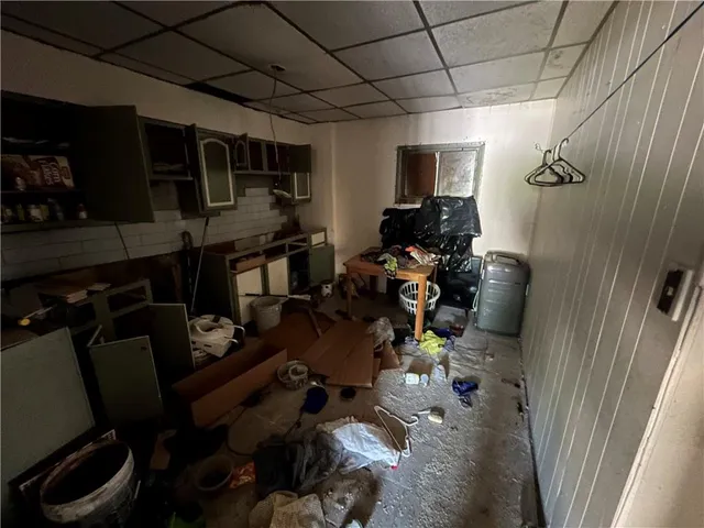 a living room with lots of furniture and a flat screen tv