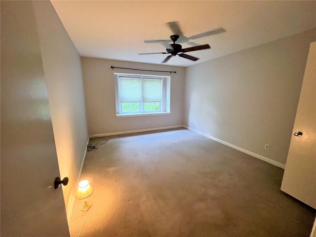 82 Montre Square Northwest Atlanta, GA 30327 - Photo 29 of 44 a view of a livingroom with a ceiling fan and window