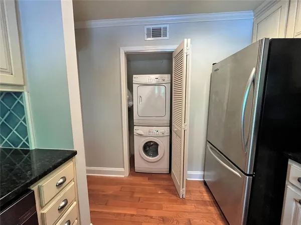 a view of a kitchen from the hallway