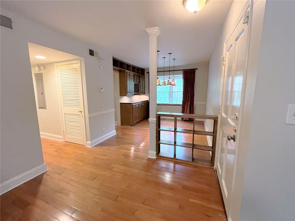 82 Montre Square Northwest Atlanta, GA 30327 - Photo 8 of 44 wooden floor in an empty room with a window