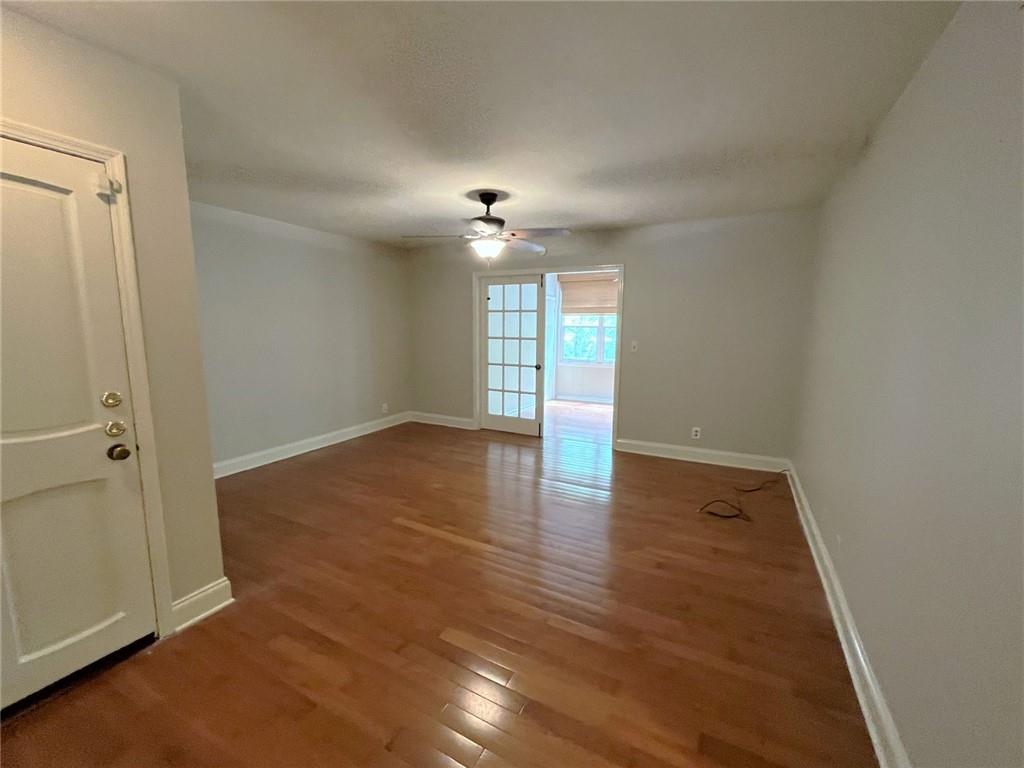 82 Montre Square Northwest Atlanta, GA 30327 - Photo 10 of 44 wooden floor in an empty room with a window
