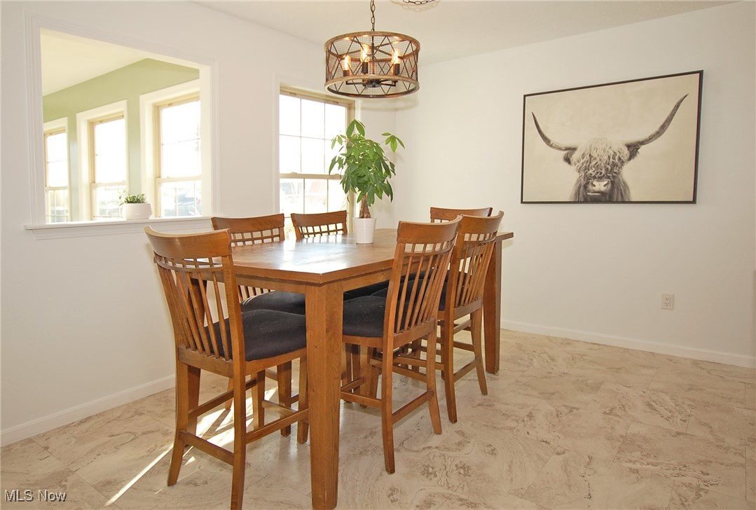 26875 W Road Wellington, OH 44090 - Photo 6 of 26 Dining room featuring an inviting chandelier
