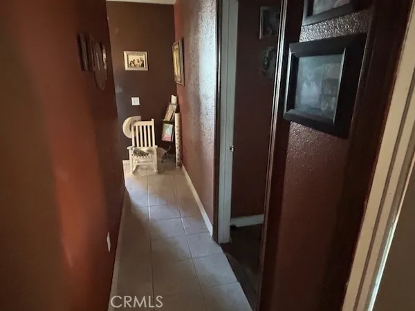 a kitchen with a sink cabinets and wooden floor