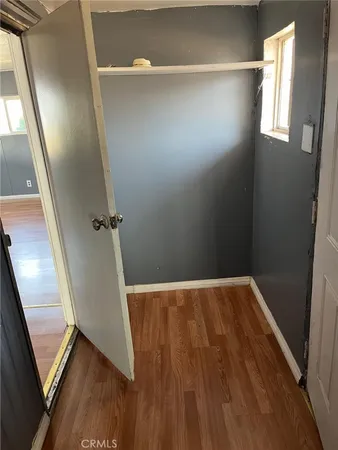 a view of an empty room with a balcony