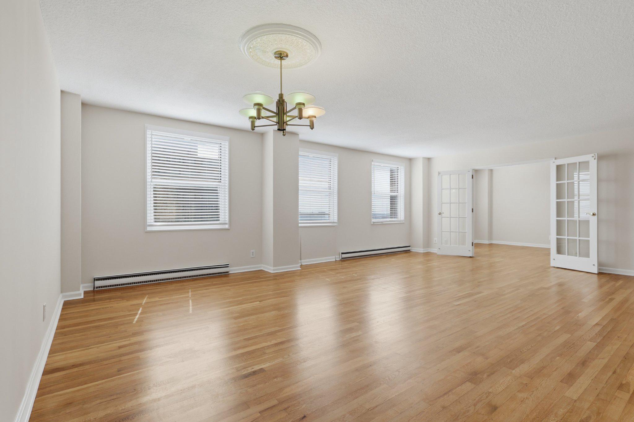 1101 St Paul Street, Unit 1212 Baltimore, MD 21202 - Photo 19 of 36 Spacious, sunlit open living/dining area.
