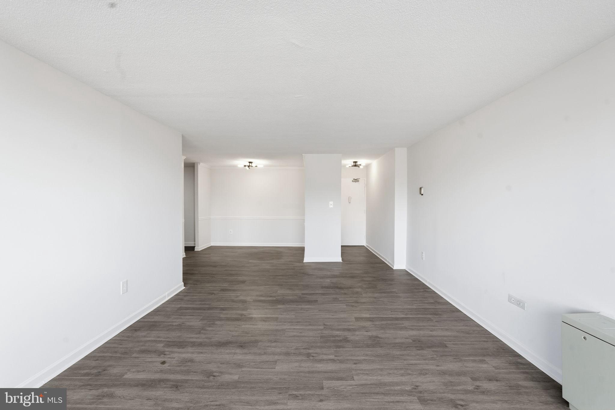 4600 South Four Mile Run Drive, Unit 613 Arlington, VA 22204 - Photo 11 of 24 a view of an empty room and wooden floor