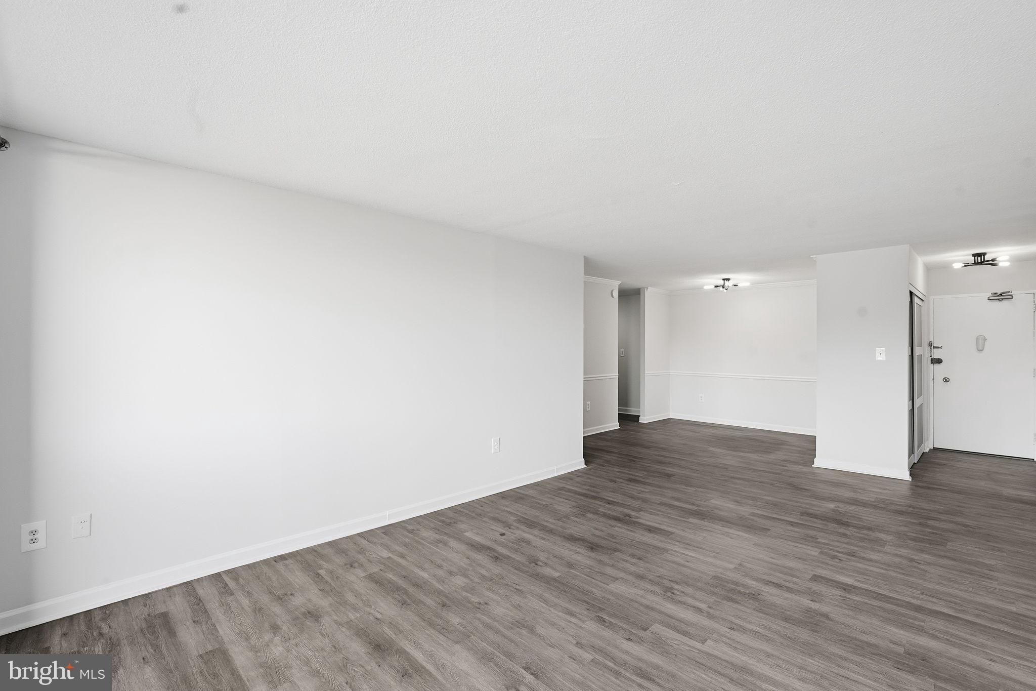 4600 South Four Mile Run Drive, Unit 613 Arlington, VA 22204 - Photo 12 of 24 a view of an empty room and wooden floor