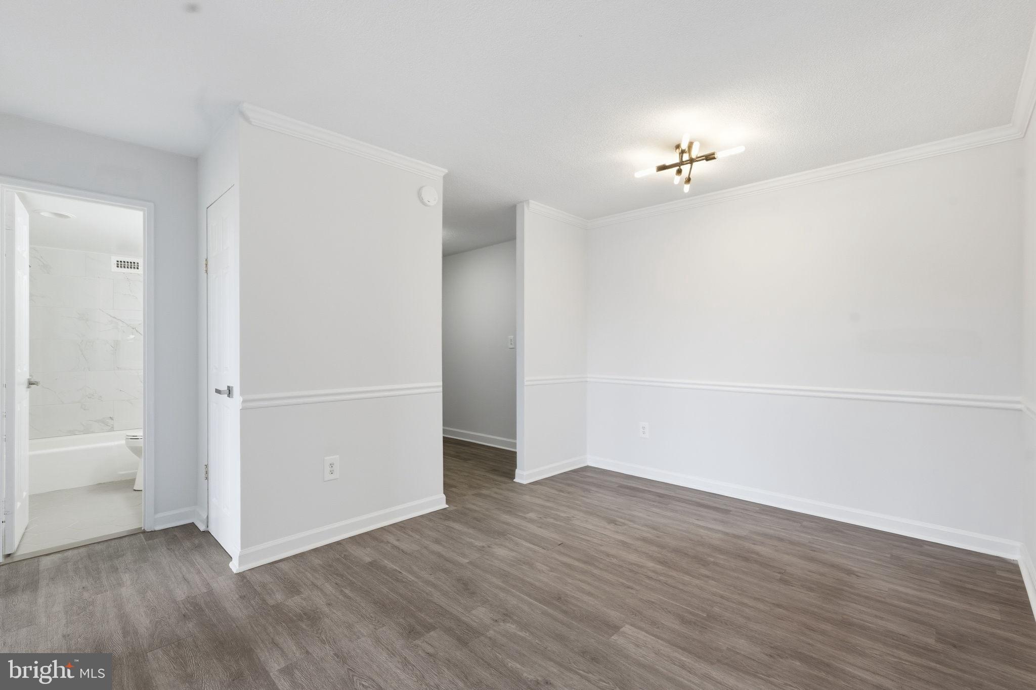 4600 South Four Mile Run Drive, Unit 613 Arlington, VA 22204 - Photo 16 of 24 wooden floor in an empty room with a window