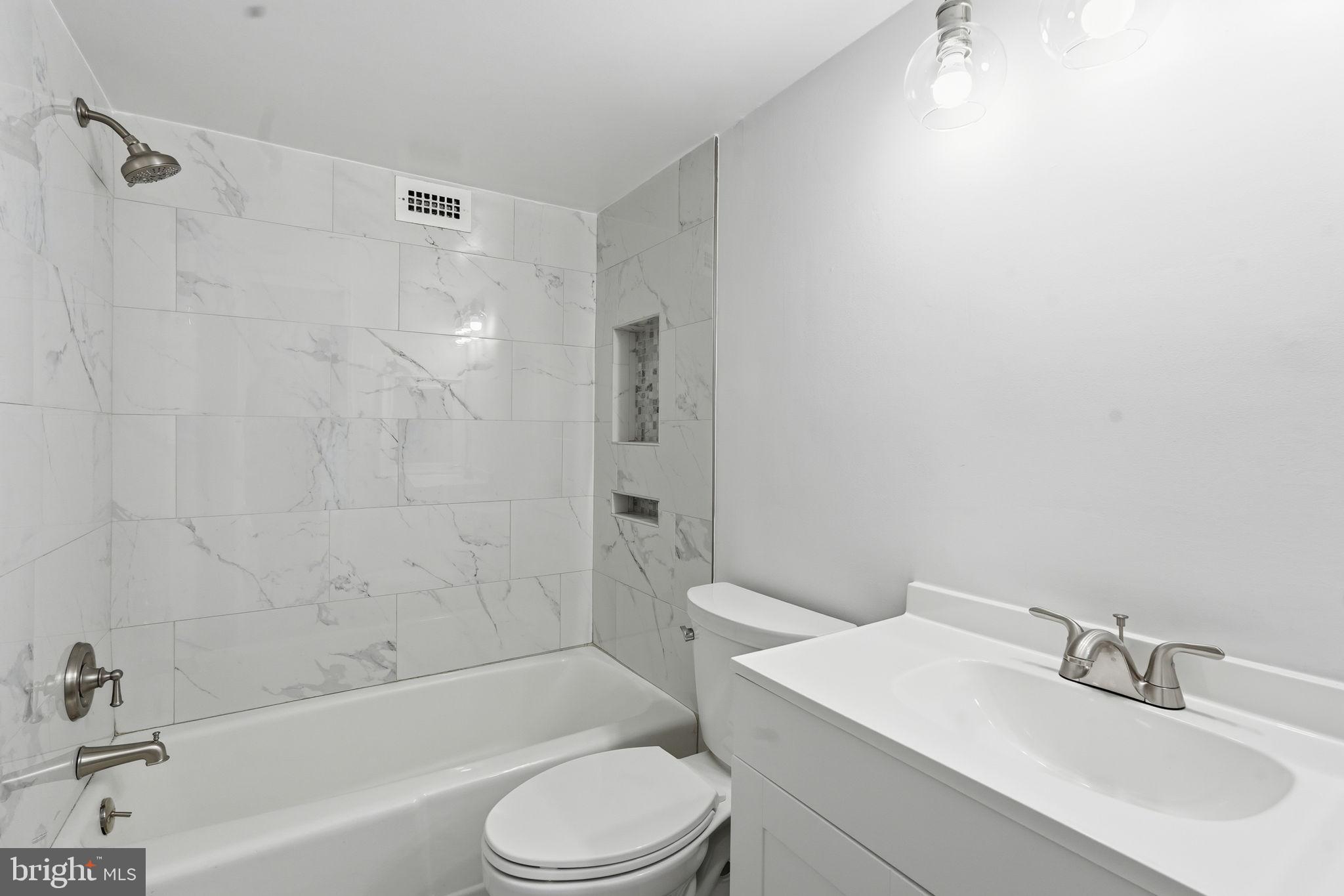 4600 South Four Mile Run Drive, Unit 613 Arlington, VA 22204 - Photo 20 of 24 a bathroom with a sink toilet and shower