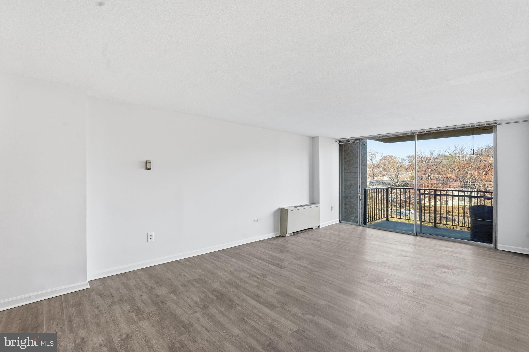4600 South Four Mile Run Drive, Unit 613 Arlington, VA 22204 - Photo 9 of 24 a view of an empty room with a window