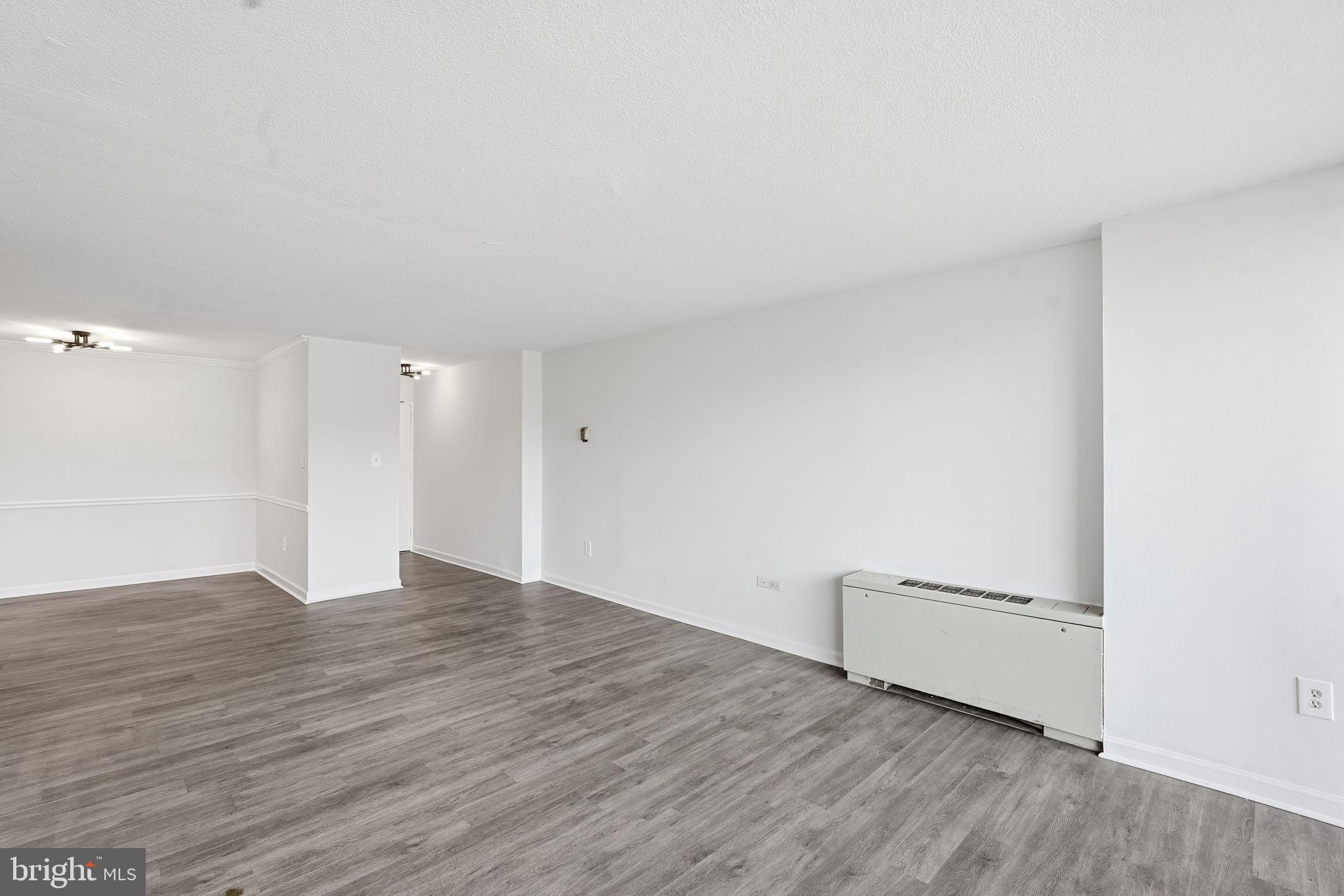 4600 South Four Mile Run Drive, Unit 613 Arlington, VA 22204 - Photo 10 of 24 a view of an empty room and wooden floor