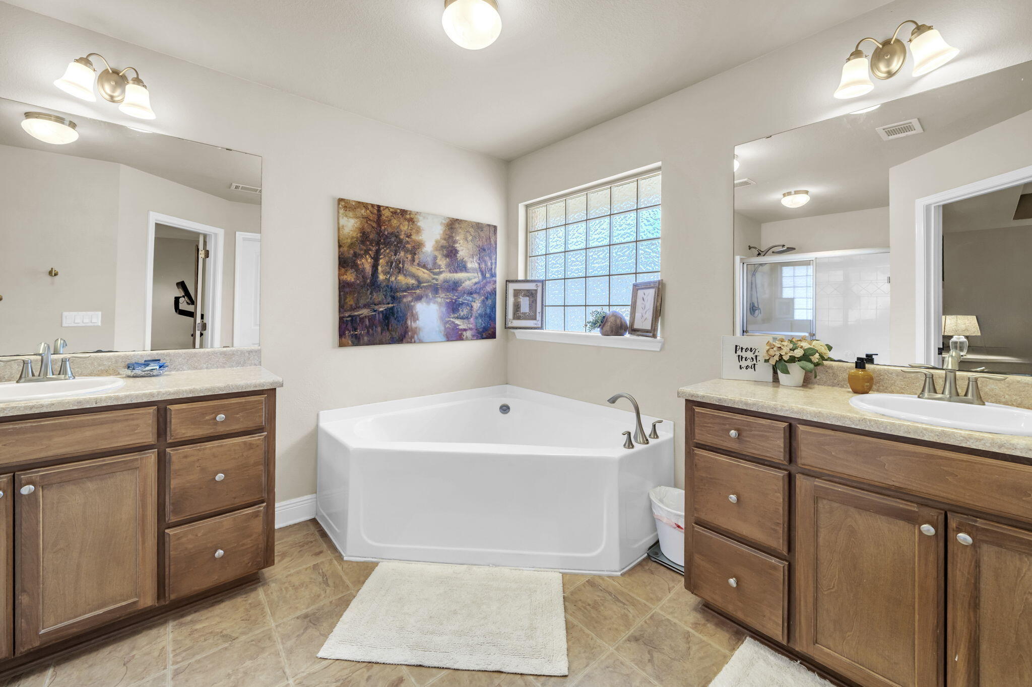 217 Raptor Drive Crestview, FL 32536 - Photo 29 of 48 a spacious bathroom with a tub sink double vanity granite and tub