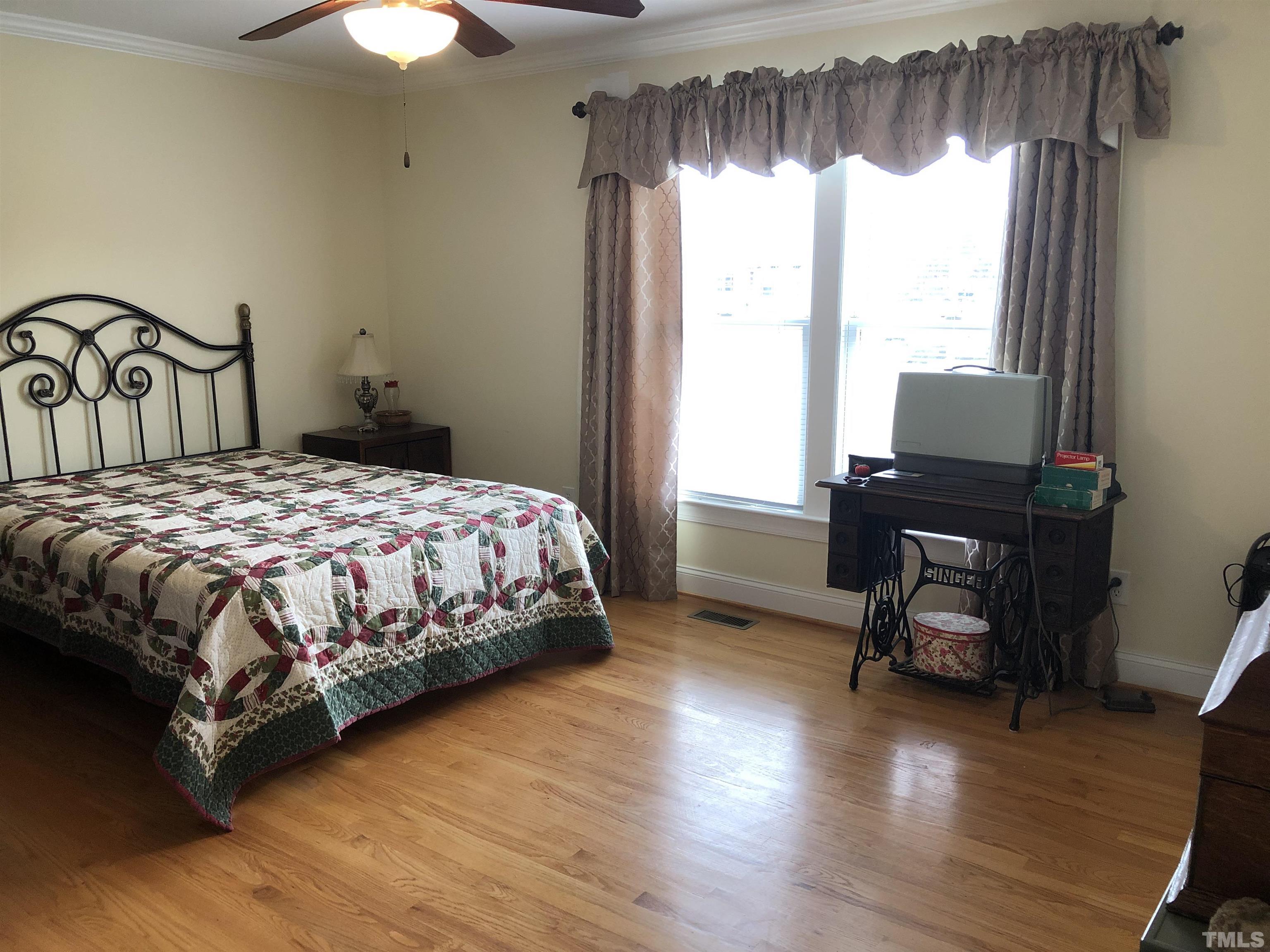 770 Cross Link Drive Angier, NC 27501 - Photo 14 of 23 a bedroom with a bed and a window