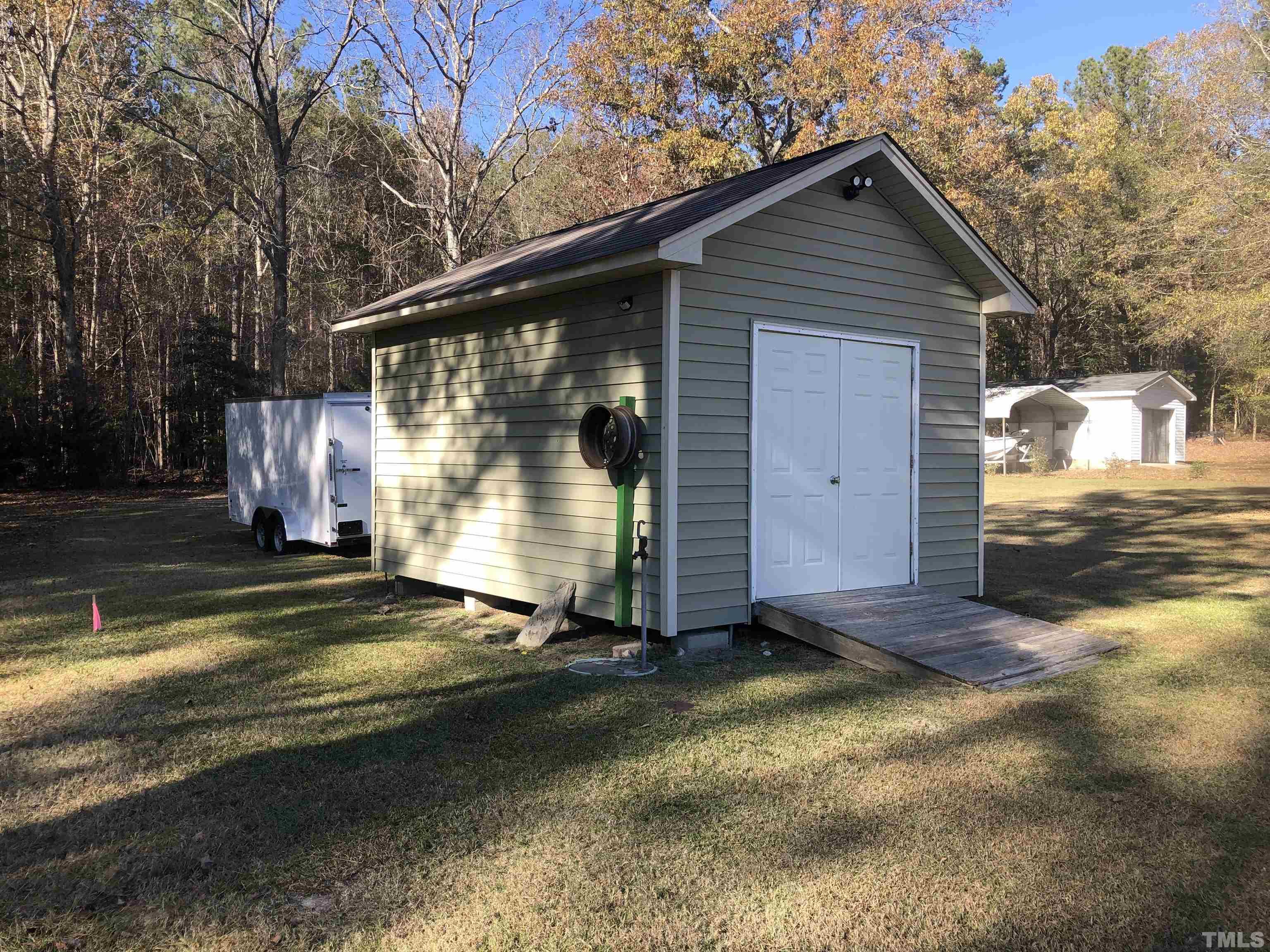 770 Cross Link Drive Angier, NC 27501 - Photo 18 of 23 a view of a small house with backyard