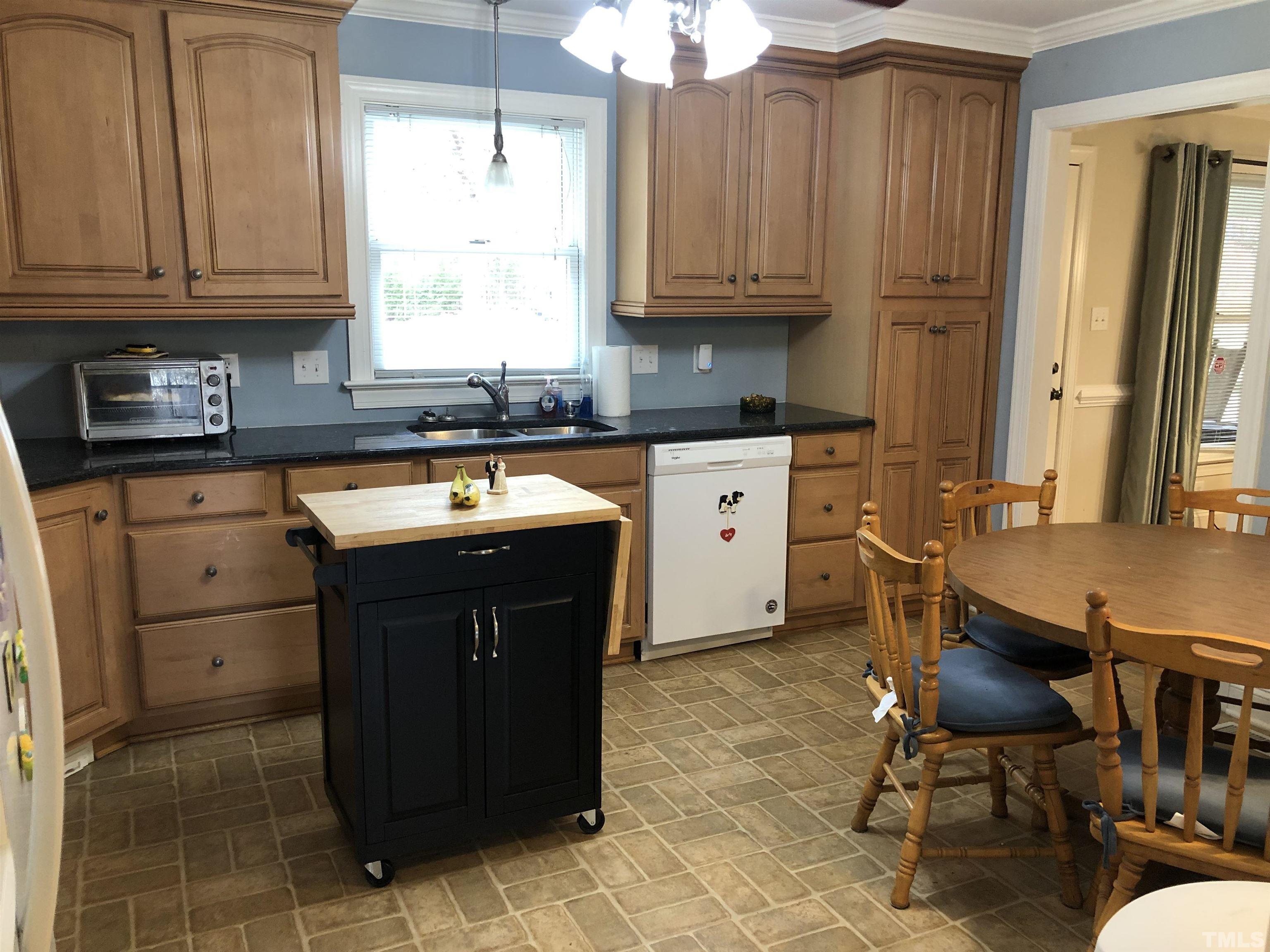 770 Cross Link Drive Angier, NC 27501 - Photo 3 of 23 a kitchen with a sink cabinets and window
