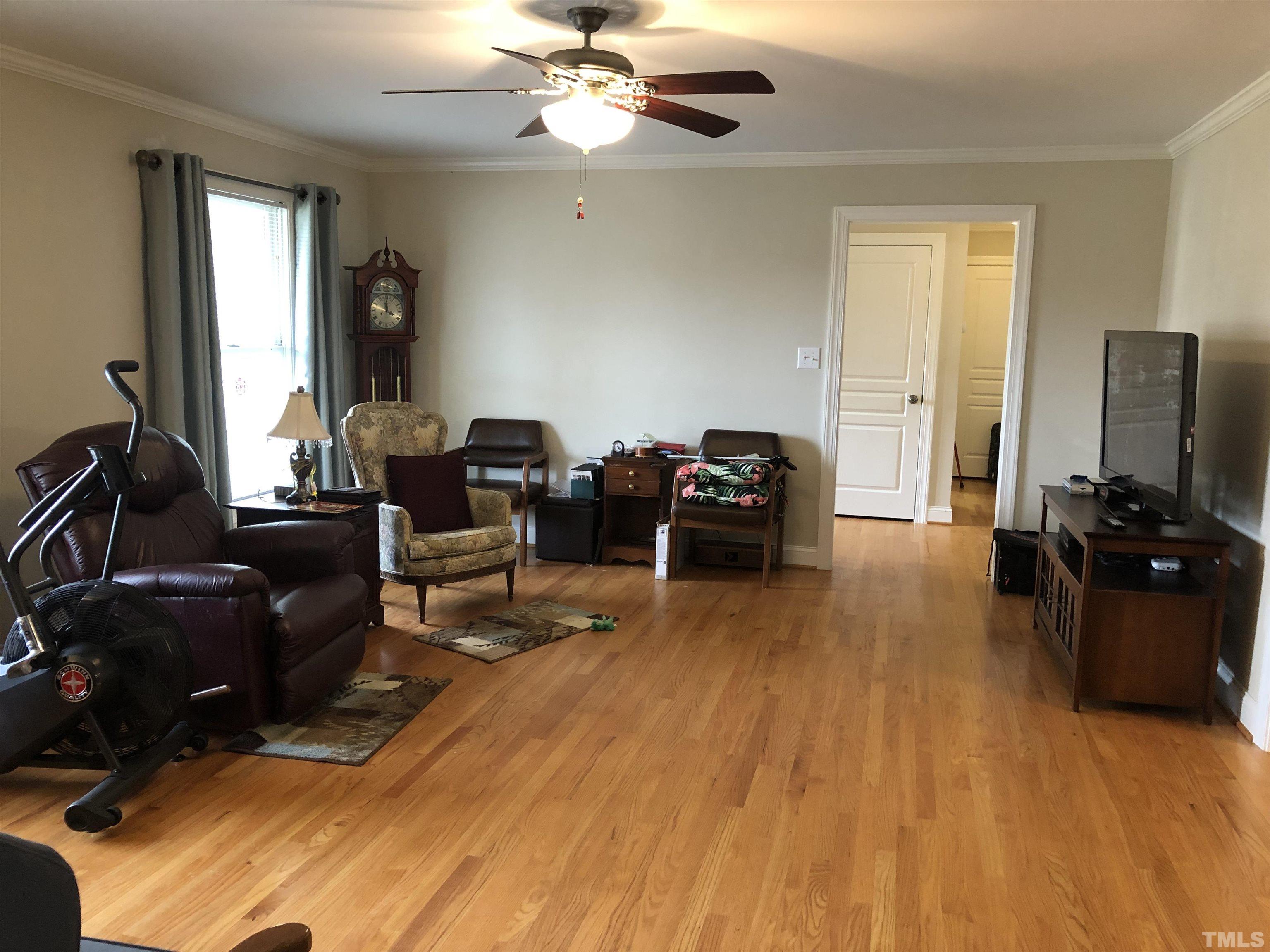 770 Cross Link Drive Angier, NC 27501 - Photo 5 of 23 a living room with furniture and a flat screen tv