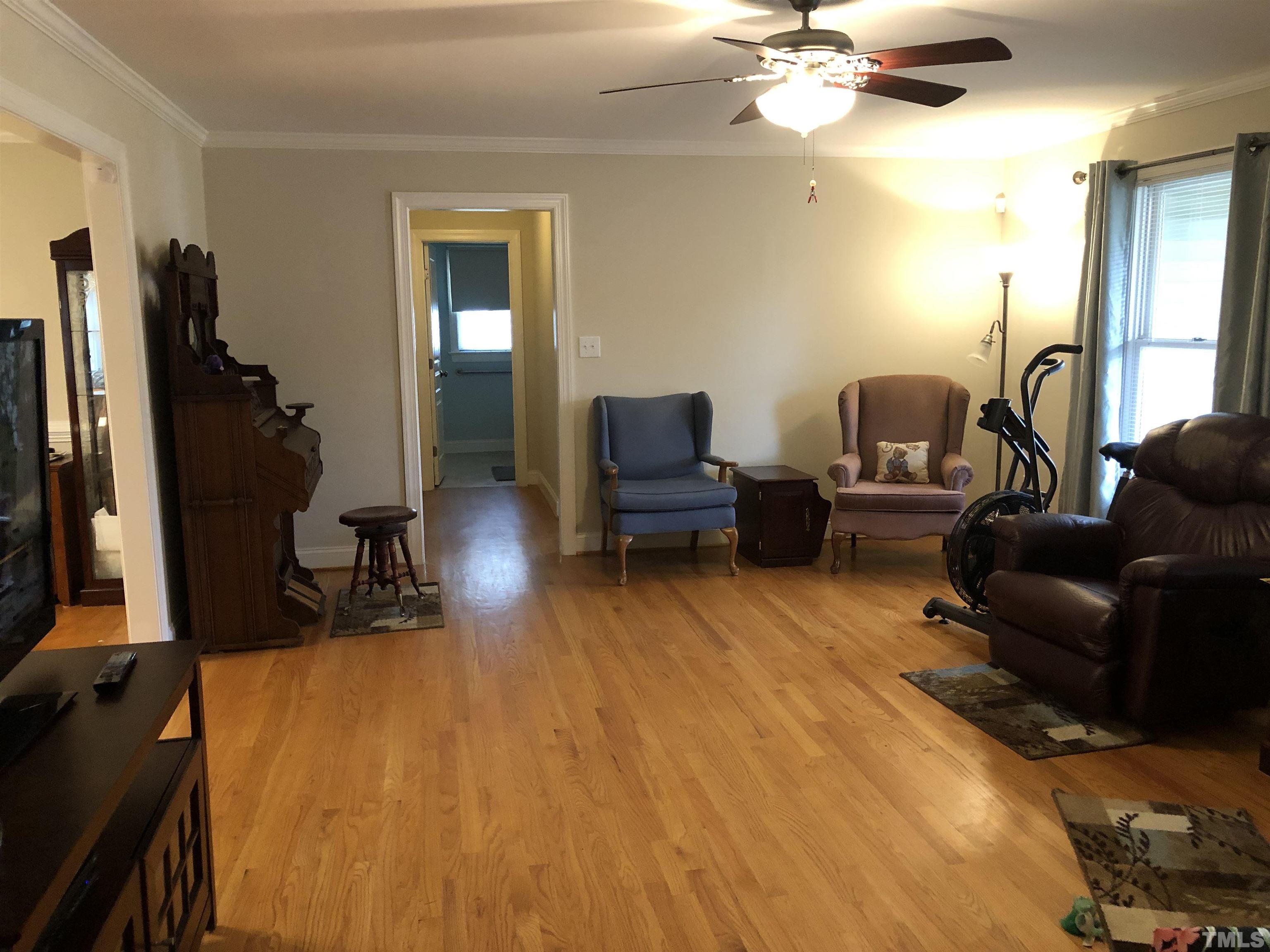 770 Cross Link Drive Angier, NC 27501 - Photo 6 of 23 a living room with furniture and a flat screen tv
