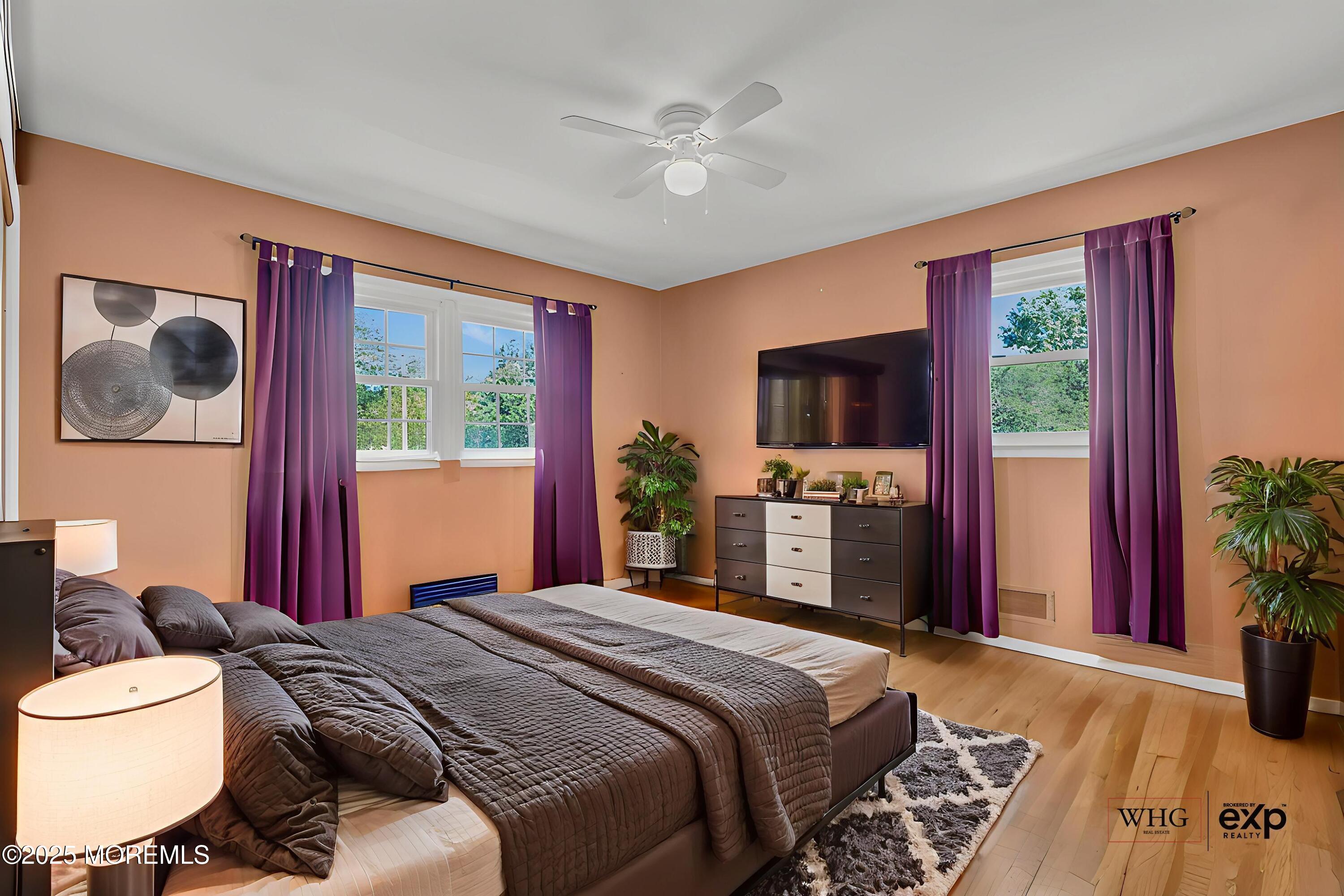 232 Bar Harbor Road Freehold, NJ 07728 - Photo 22 of 42 a bedroom with a large bed and a flat tv screen