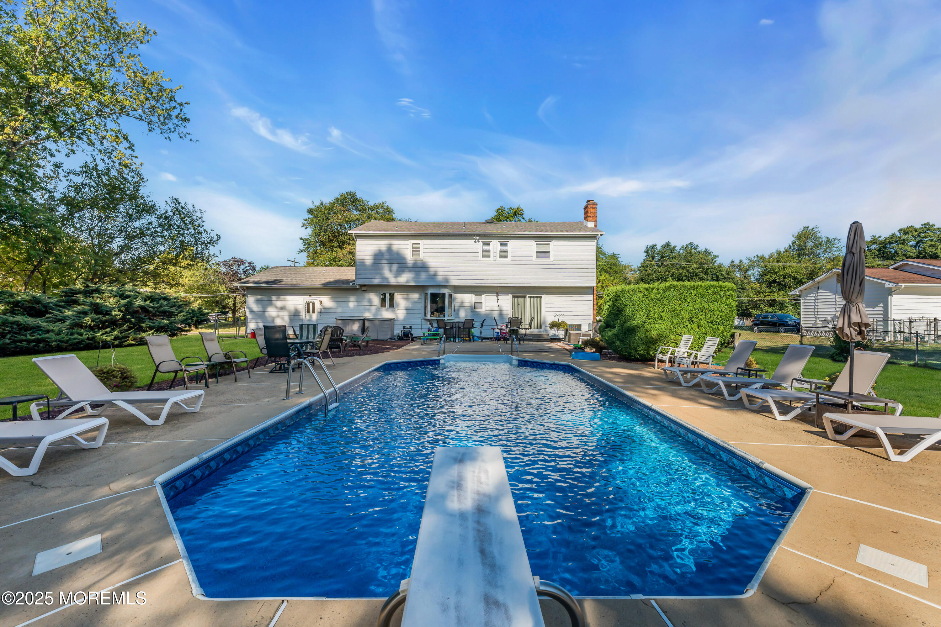 232 Bar Harbor Road Freehold, NJ 07728 - Photo 29 of 42 a view of a swimming pool with sitting area