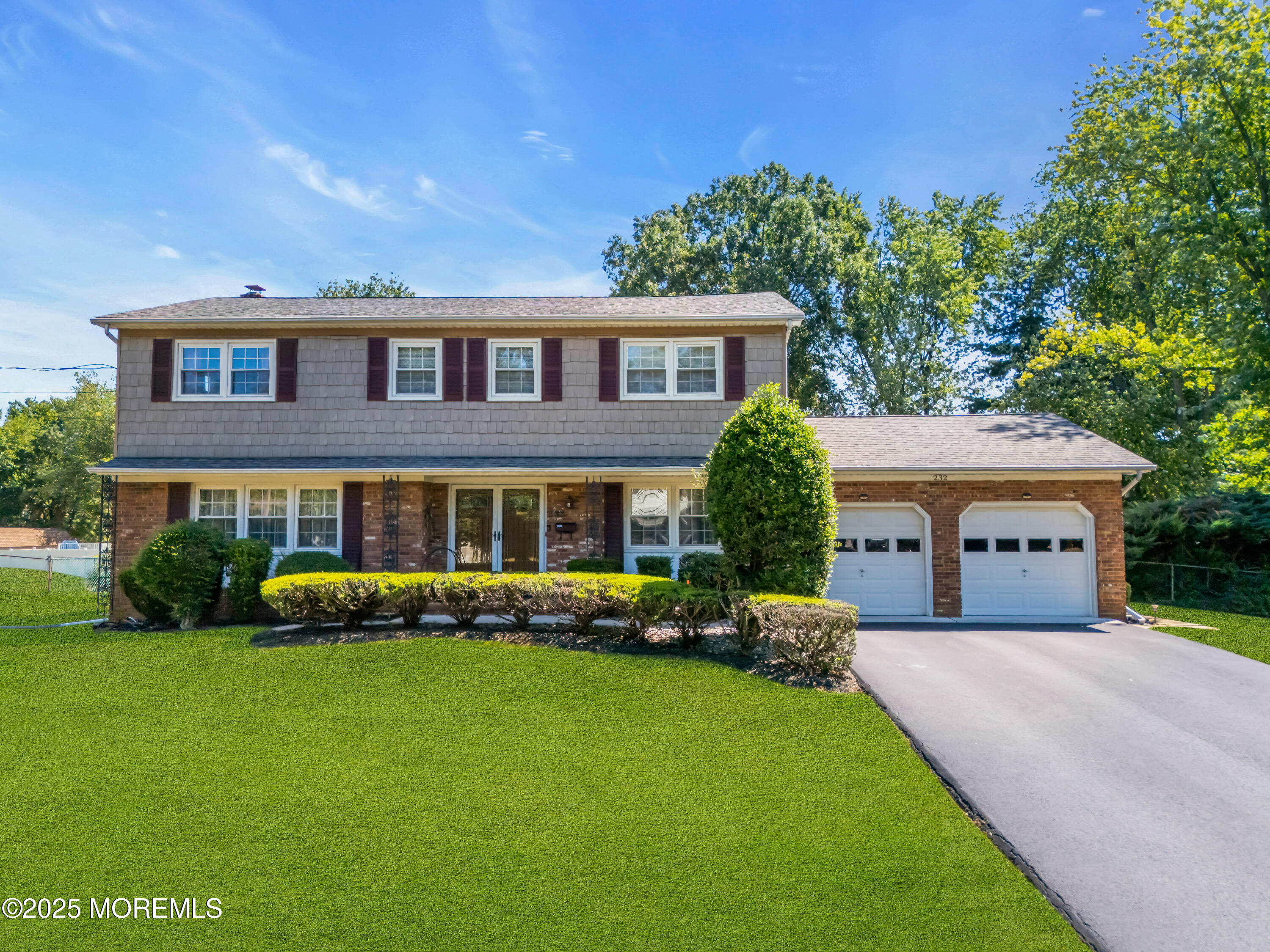 232 Bar Harbor Road Freehold, NJ 07728 - Photo 39 of 42 a front view of a house with garden