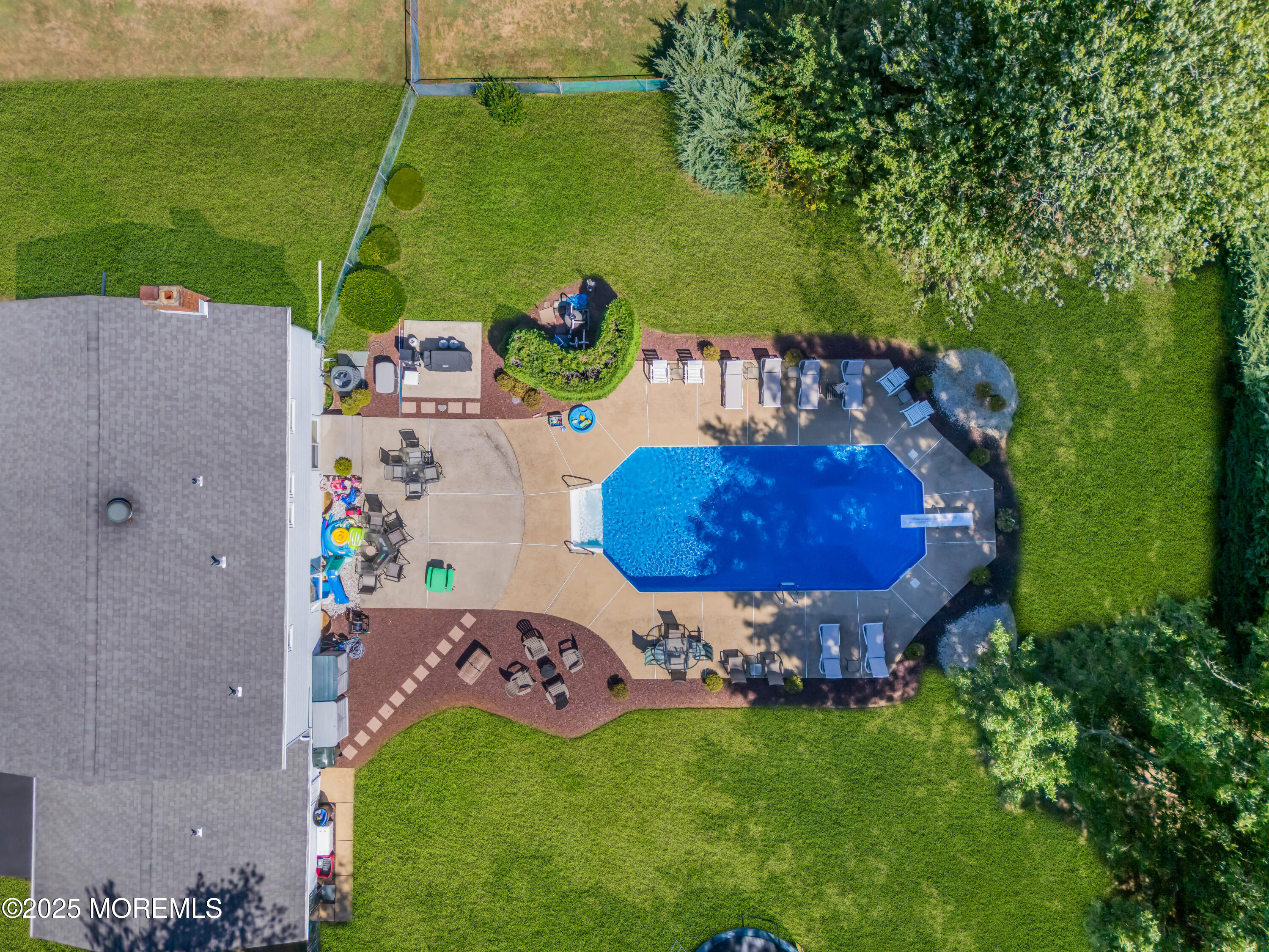 232 Bar Harbor Road Freehold, NJ 07728 - Photo 42 of 42 an aerial view of a backyard with table and chairs