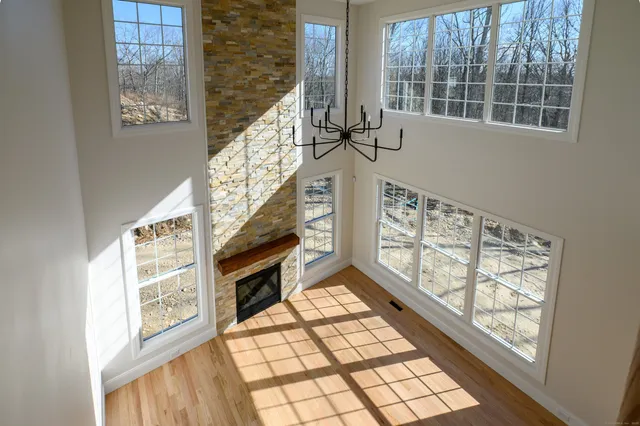 a view of an entryway with wooden floor and door