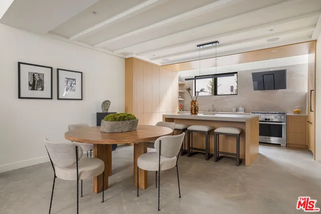 a view of a dining room with furniture and window